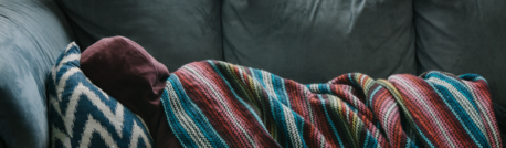 person lying on bed sick from mold