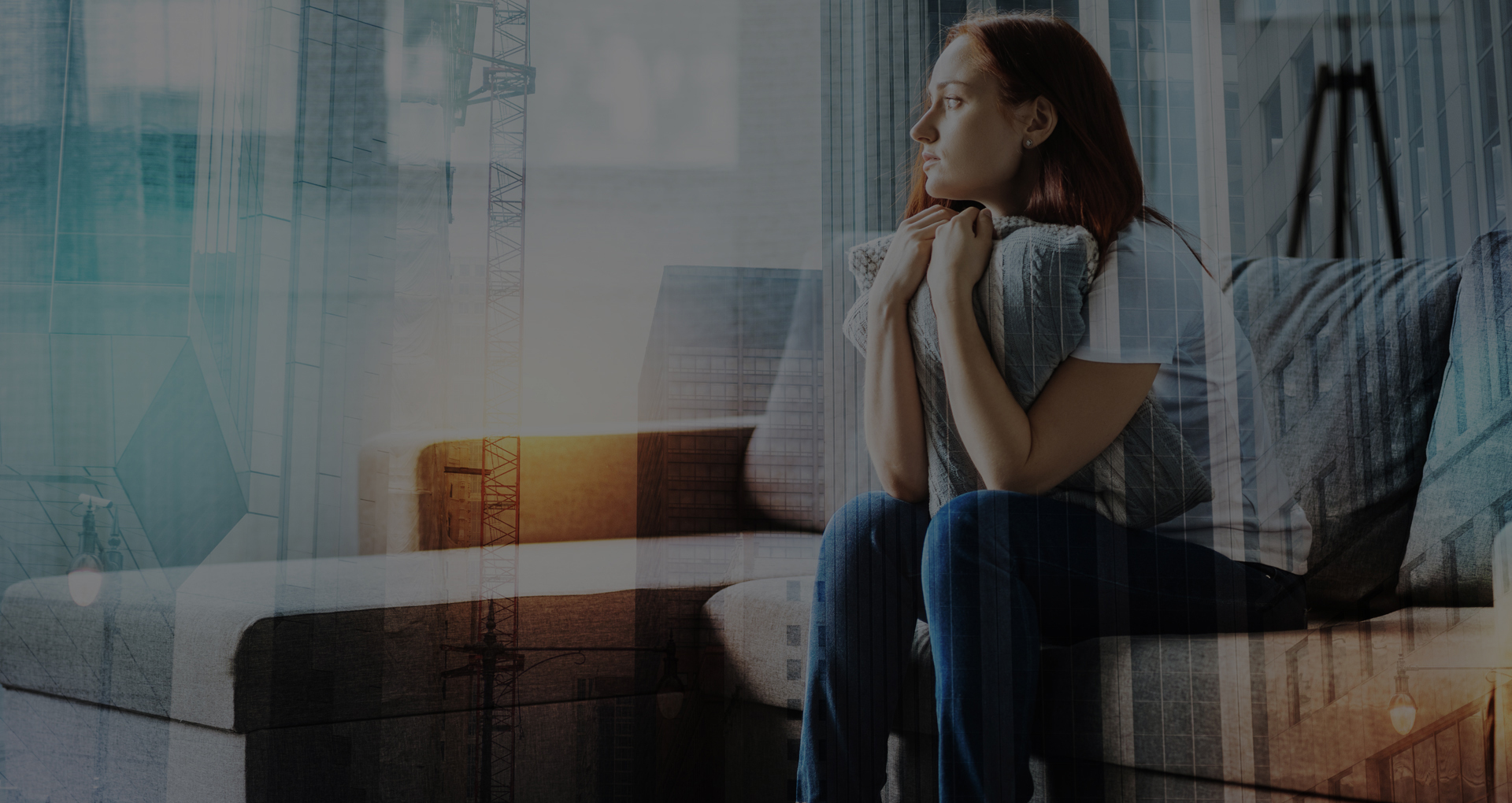 Calm upset woman hugging a pillow and looking aside